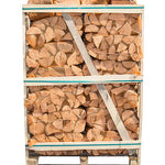 A pallet of kiln-dried hornbeam firewood logs contained within a transparent wrap, bound by metal bands.