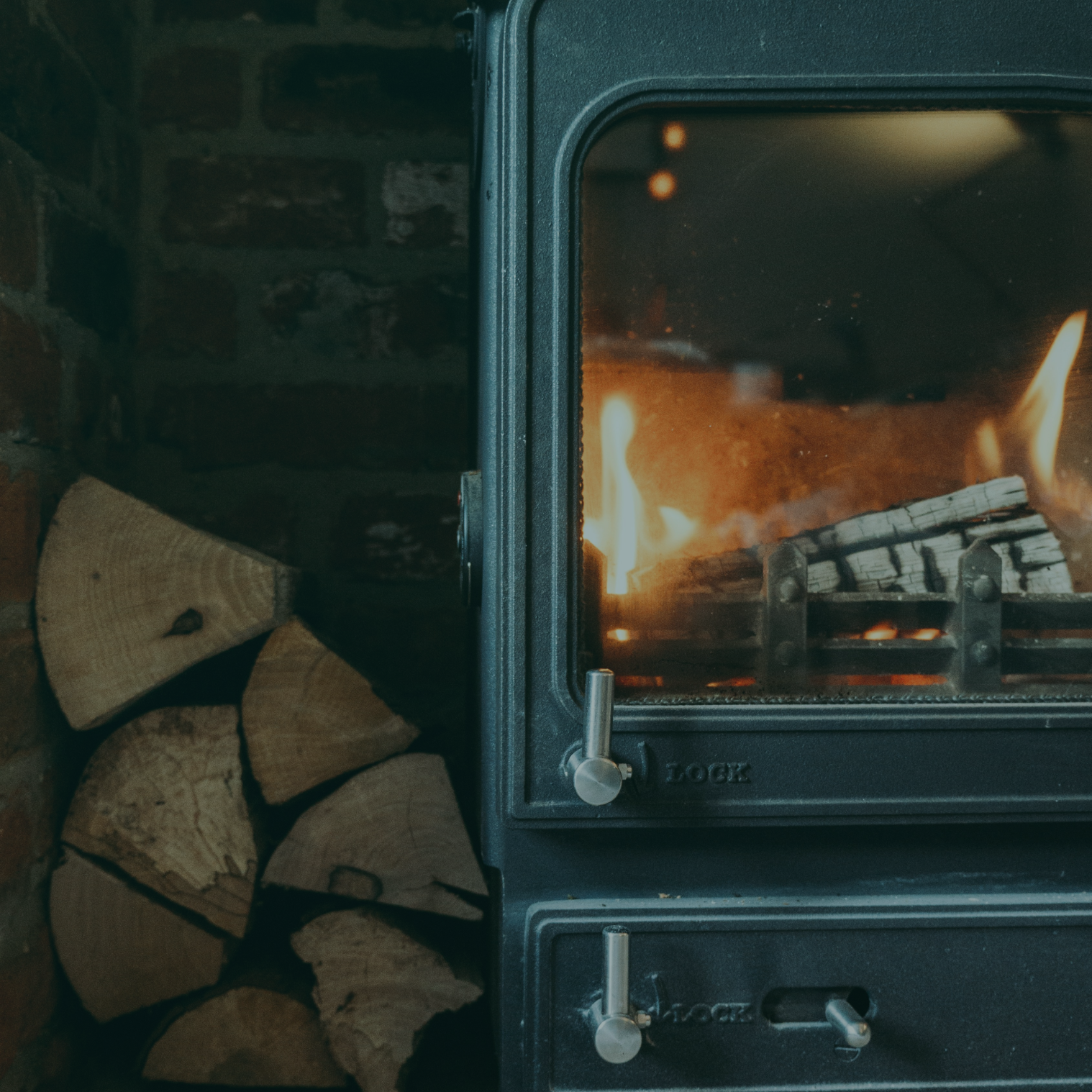 Kiln Dried Logs burning in a wood-burning stove